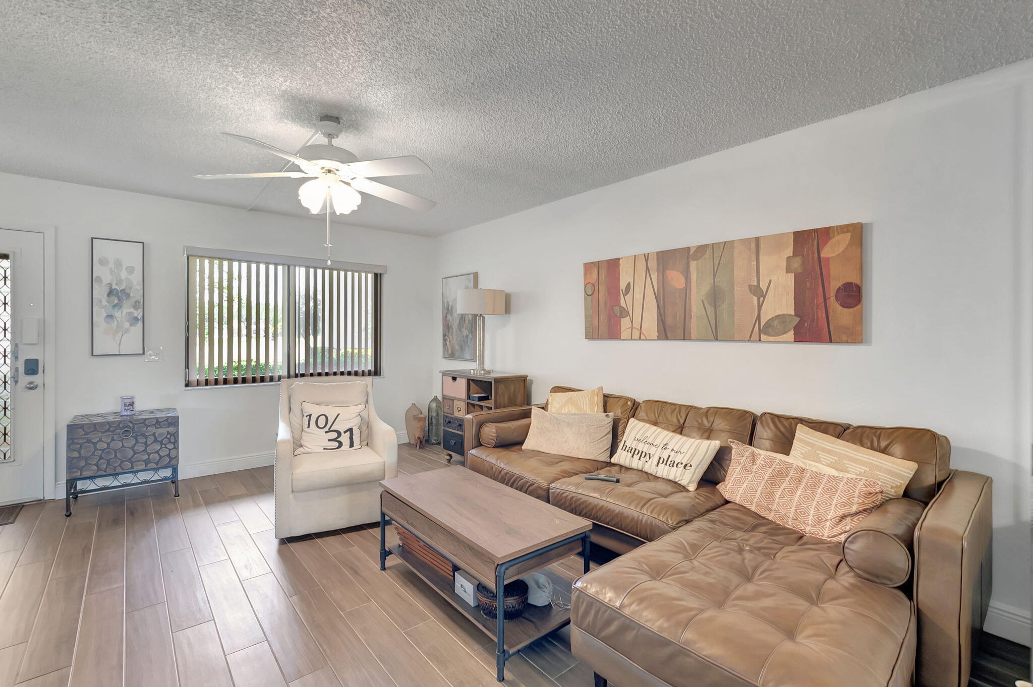 66 Capri B Delray Beach, FL 33484 - Photo 16 of 62 a living room with furniture and a wooden floor