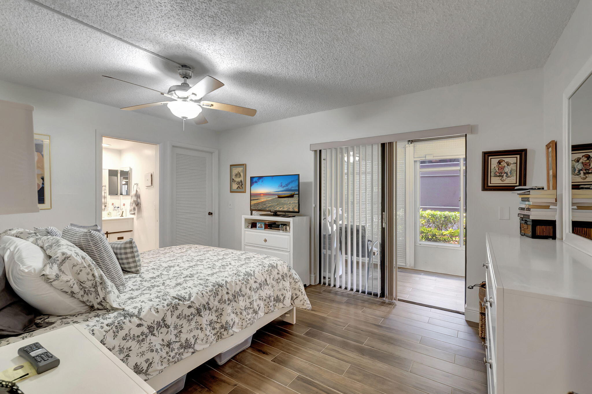 66 Capri B Delray Beach, FL 33484 - Photo 19 of 62 a bedroom with a bed dresser and a window