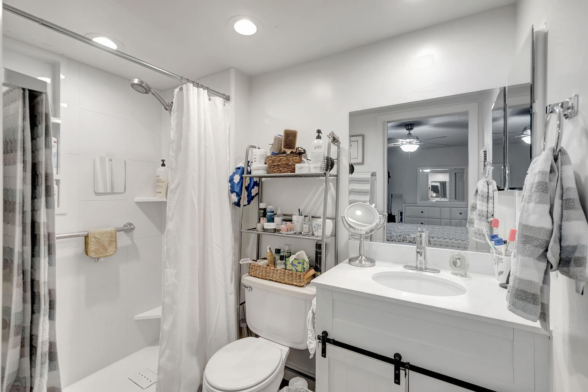 66 Capri B Delray Beach, FL 33484 - Photo 20 of 62 a bathroom with a sink toilet and shower