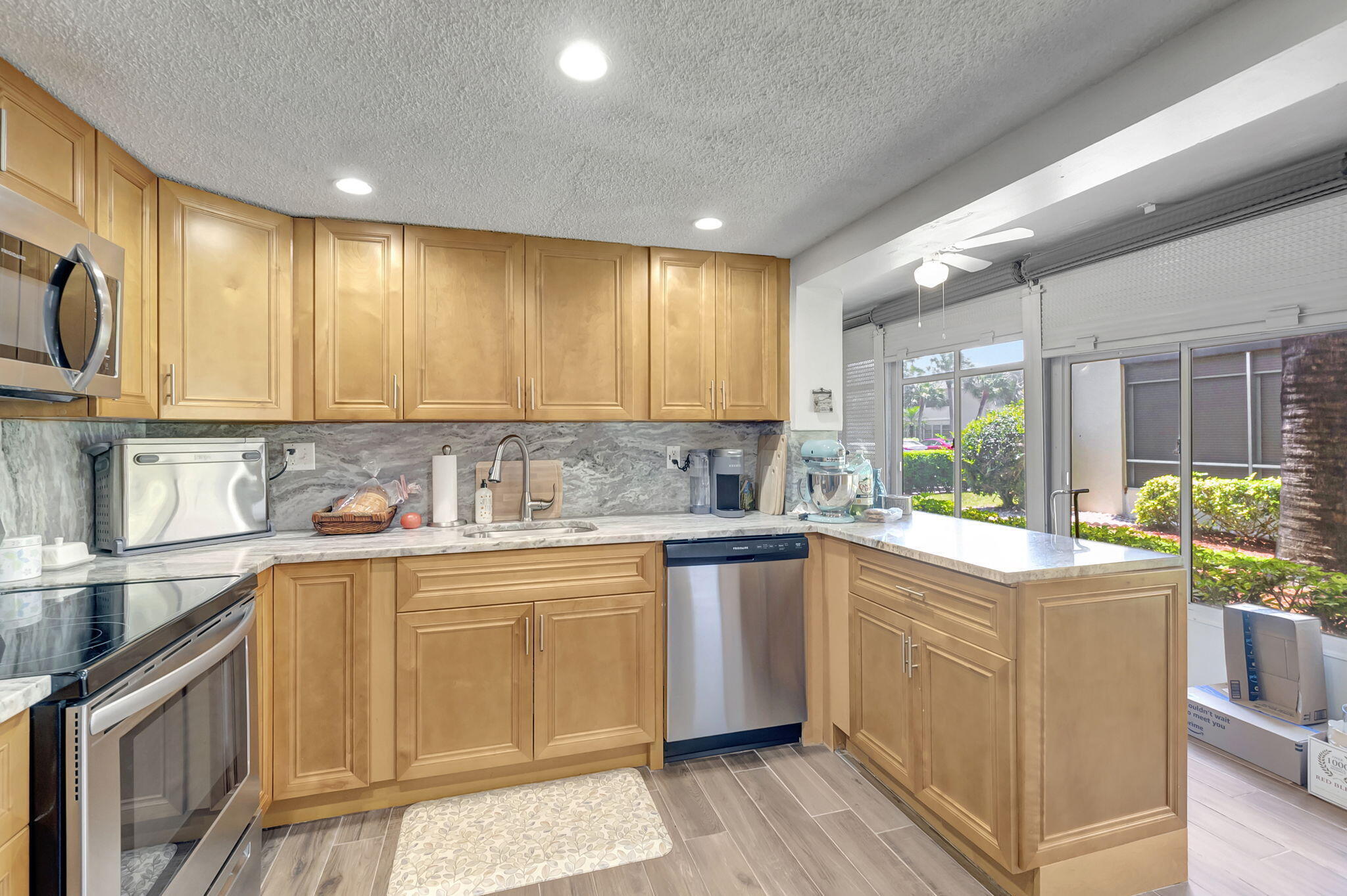66 Capri B Delray Beach, FL 33484 - Photo 10 of 62 a kitchen with a sink cabinets and window