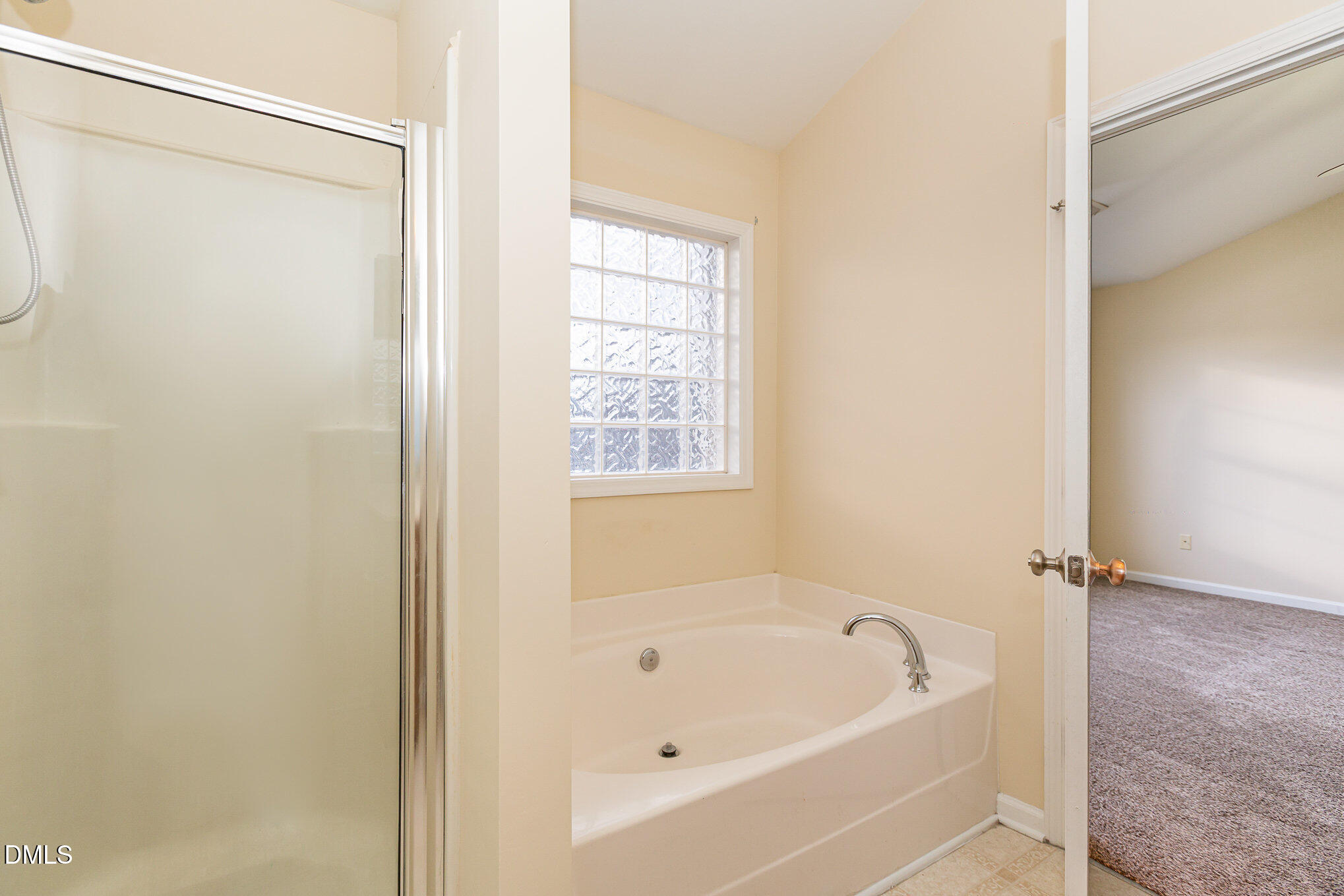 2124 Star Sapphire Drive Raleigh, NC 27610 - Photo 17 of 23 a white bath tub sitting next to a window