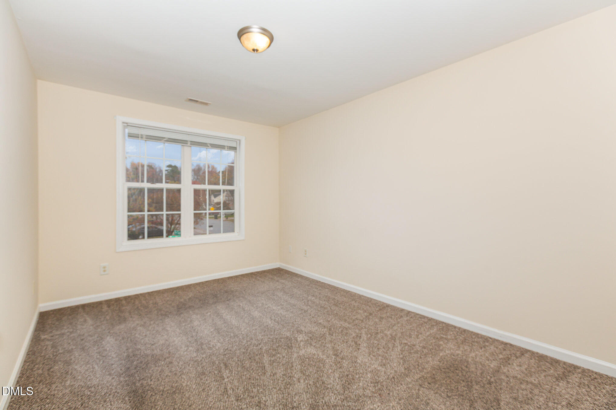 2124 Star Sapphire Drive Raleigh, NC 27610 - Photo 18 of 23 an empty room with a window