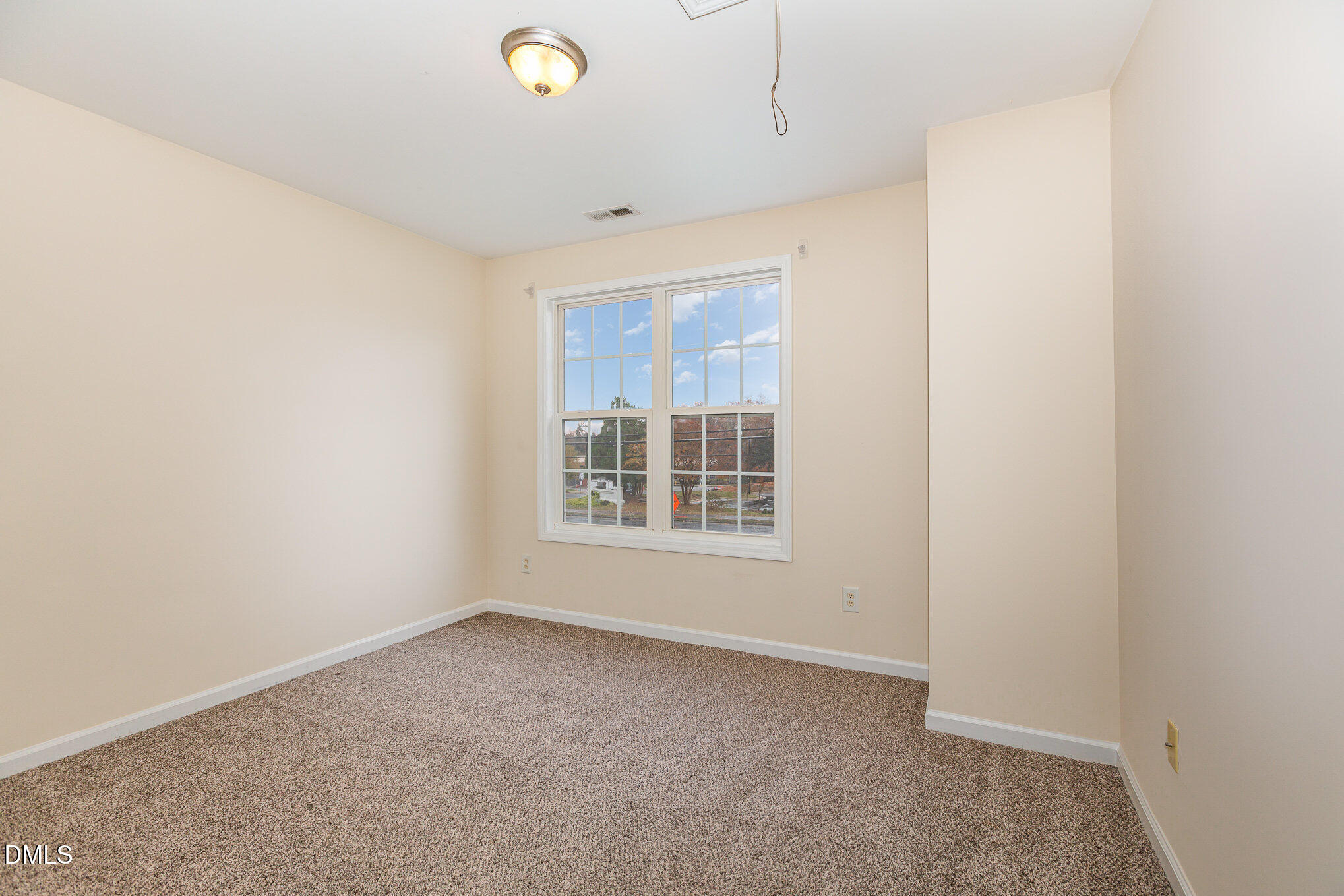 2124 Star Sapphire Drive Raleigh, NC 27610 - Photo 19 of 23 a view of an empty room with a window