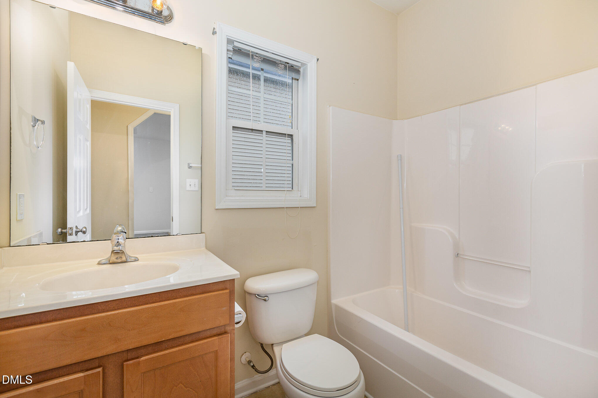 2124 Star Sapphire Drive Raleigh, NC 27610 - Photo 22 of 23 a bathroom with a sink toilet and shower