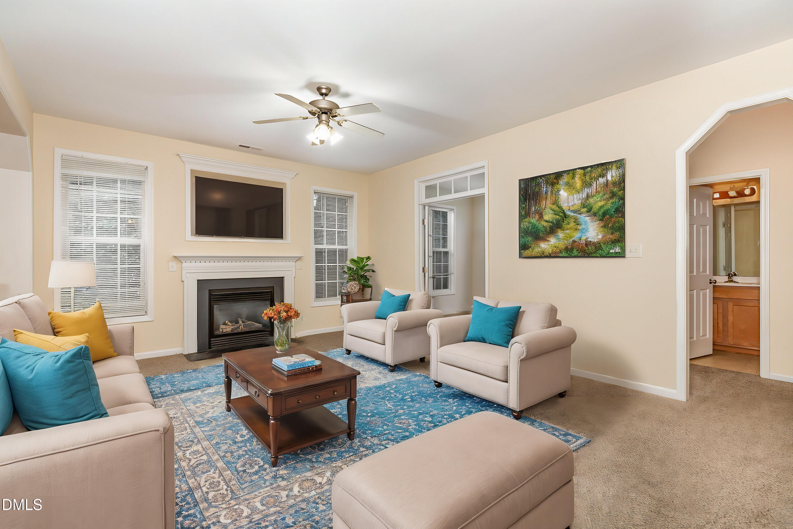 2124 Star Sapphire Drive Raleigh, NC 27610 - Photo 6 of 23 a living room with furniture and a fireplace