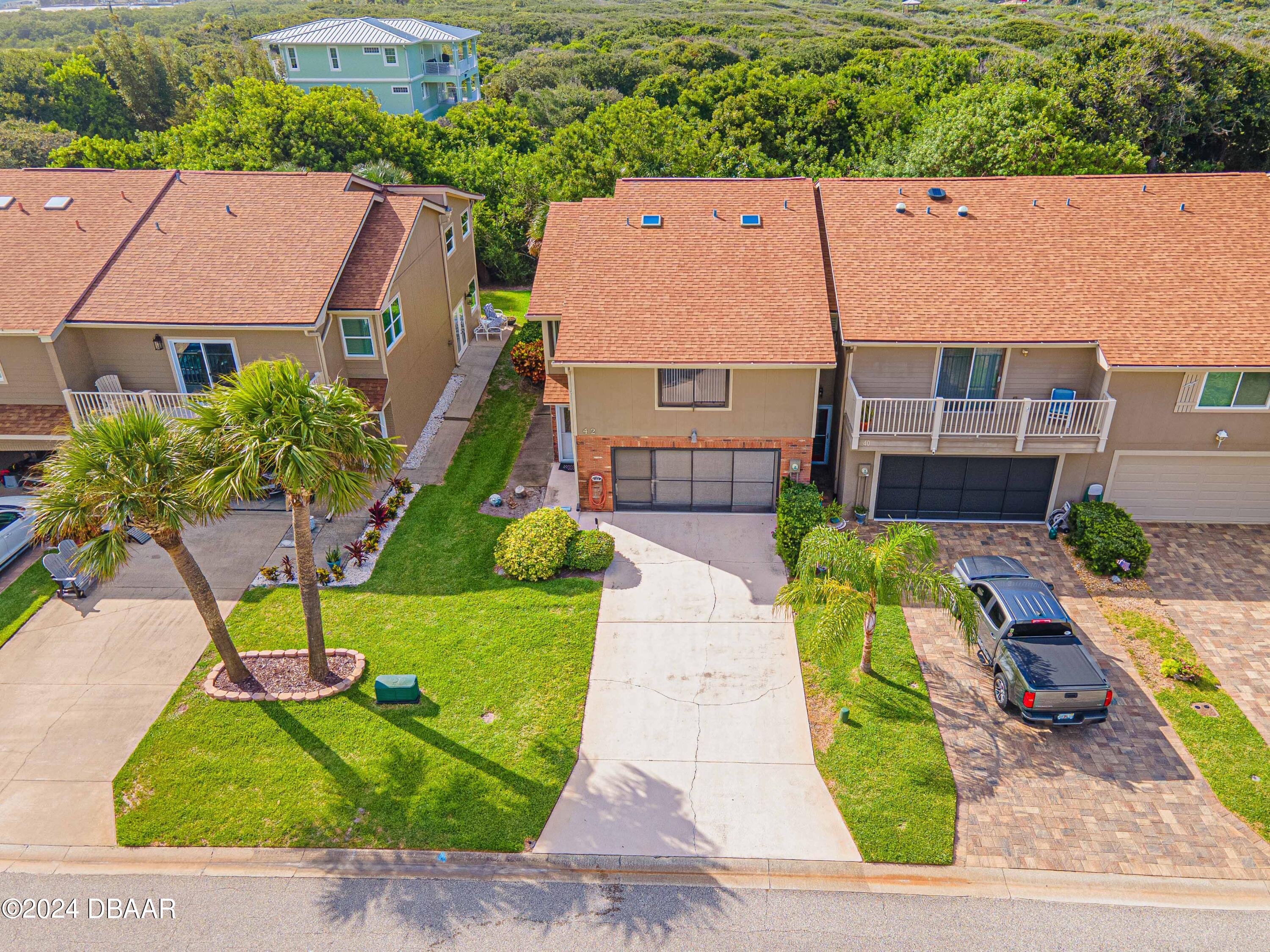 42 Jana Drive Ponce Inlet, FL 32127 - Photo 21 of 34 an aerial view of a house with a garden