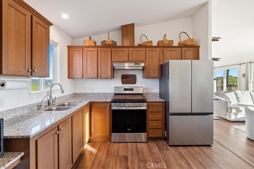 1730 Sutliff Road San Miguel, CA 93451 - Photo 14 of 57 a kitchen with stainless steel appliances granite countertop a refrigerator a stove and a sink