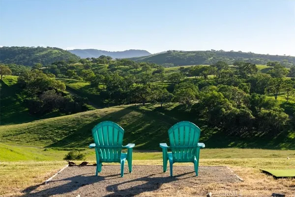 a view of a two chairs in the terrace