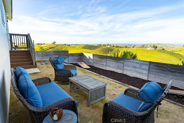 a view of a terrace with furniture