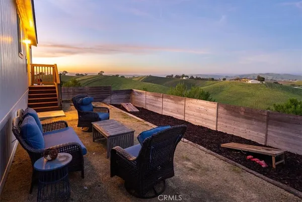 a view of a terrace with furniture
