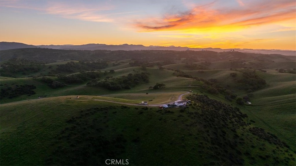 1730 Sutliff Road San Miguel, CA 93451 - Photo 55 of 57 a view of a lush green hillside and a houses