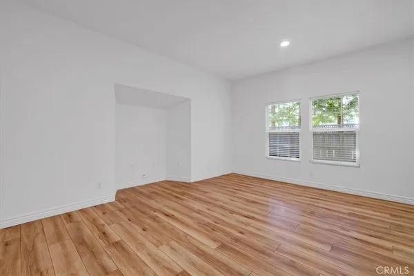 a kitchen with stainless steel appliances a sink stove and cabinets