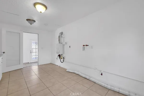 a bathroom with a toilet and a bathtub