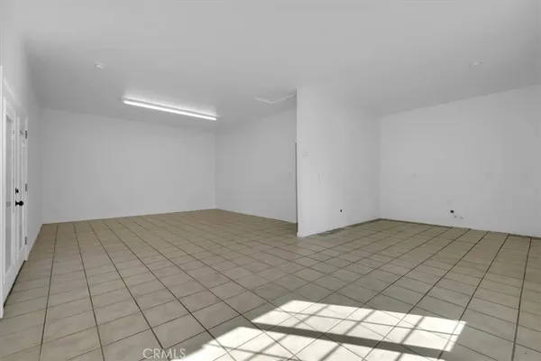 a bathroom with a double vanity sink a toilet and a mirror