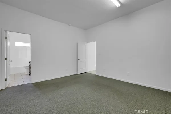 a view of an empty room with stairs