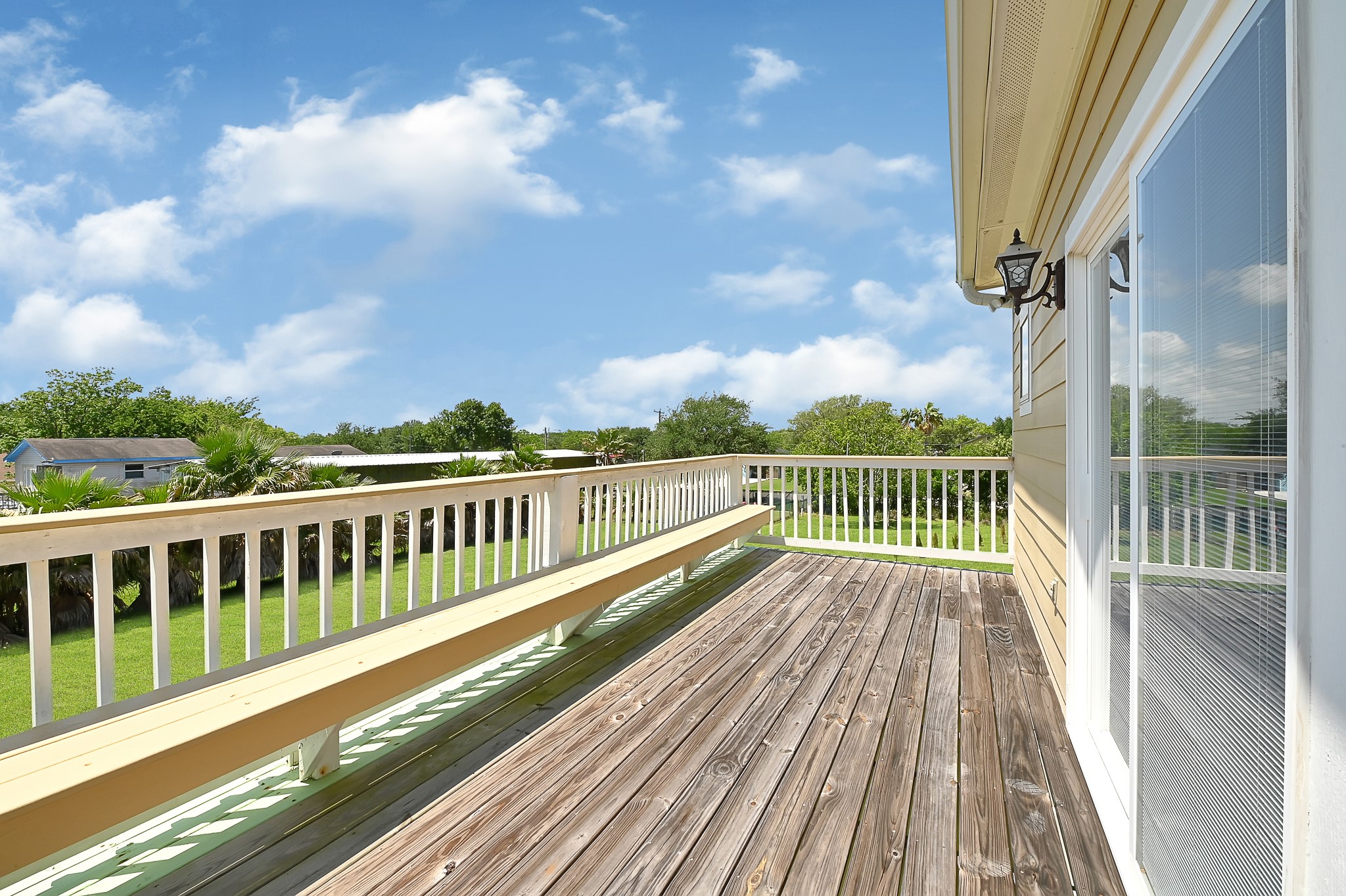 1004 8th Street Dickinson, TX 77539 - Photo 15 of 42 a view of balcony with wooden floor and fence