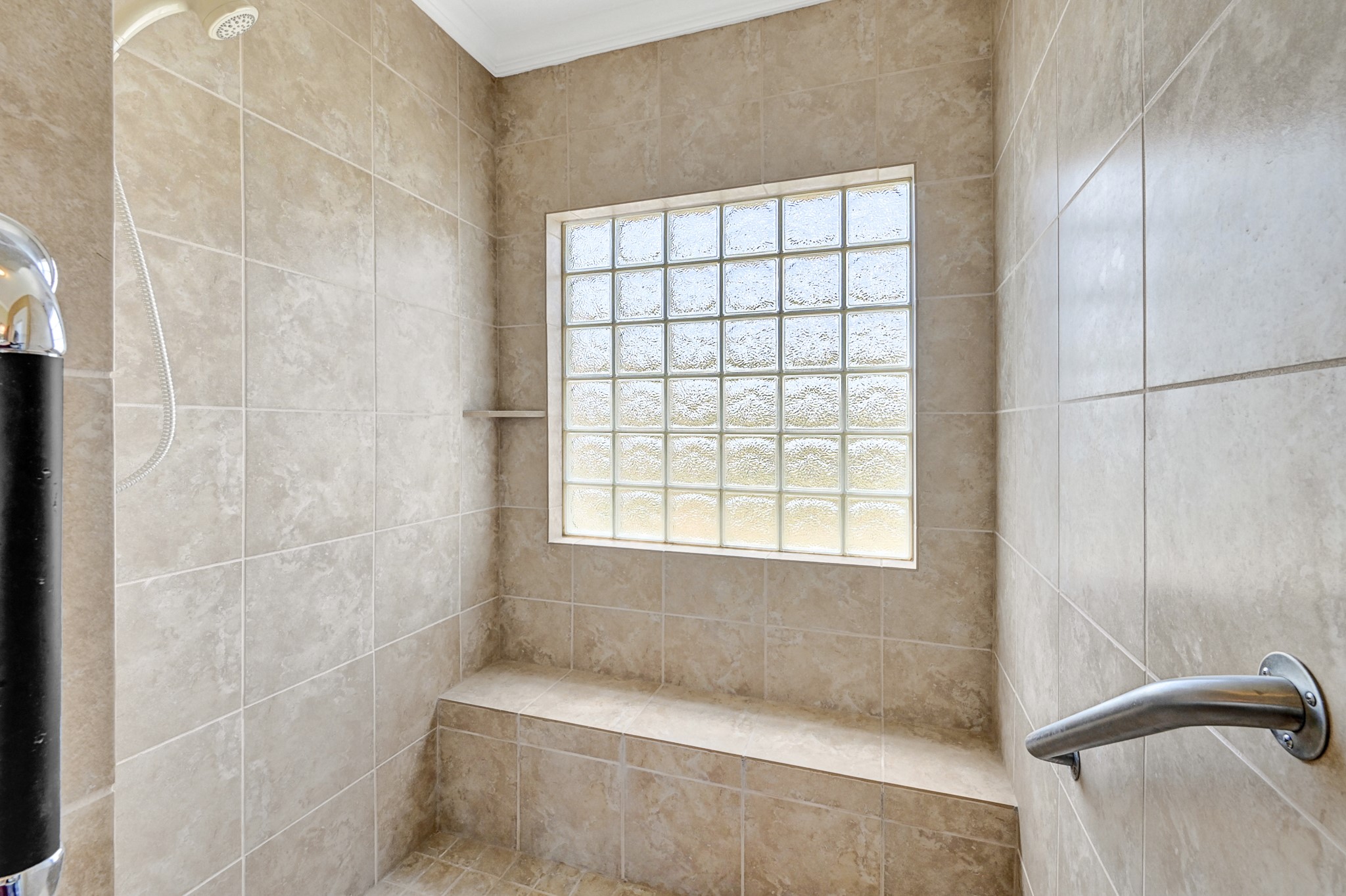 1004 8th Street Dickinson, TX 77539 - Photo 19 of 42 a bathroom with a bathtub and shower