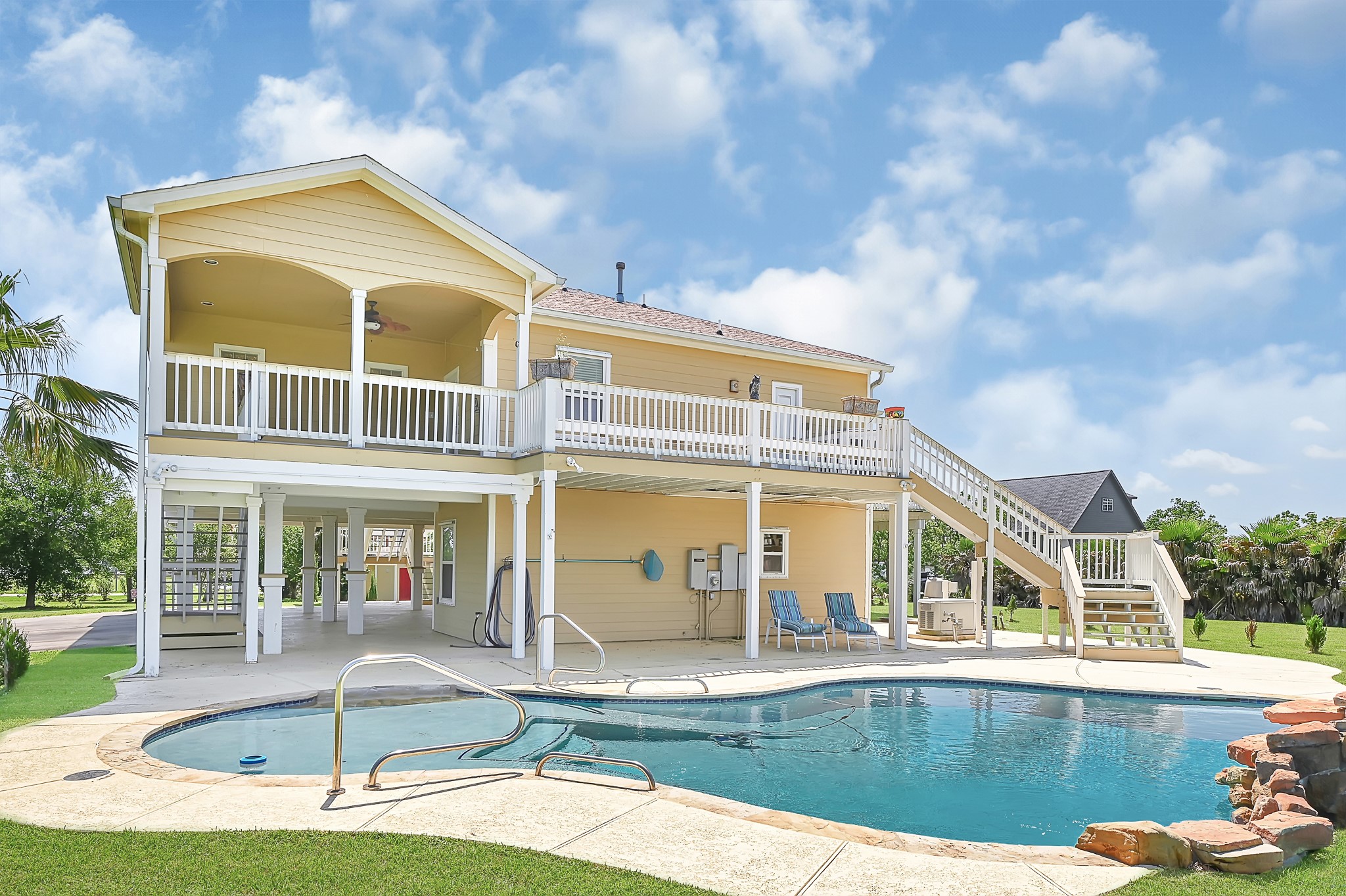 1004 8th Street Dickinson, TX 77539 - Photo 24 of 42 a front view of a house with swimming pool and porch