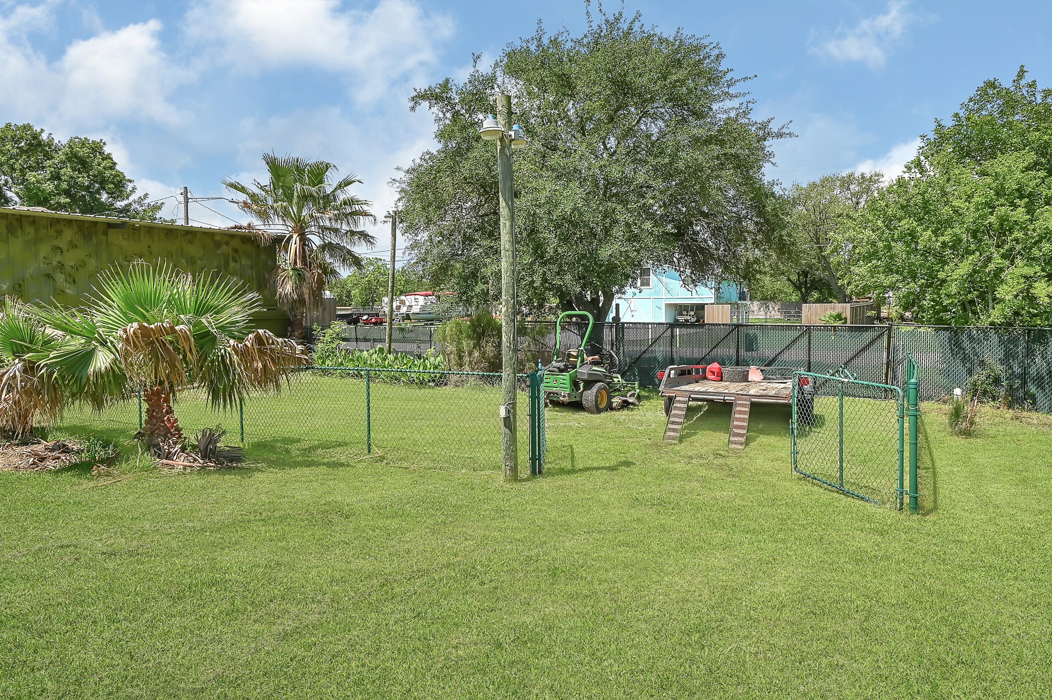 1004 8th Street Dickinson, TX 77539 - Photo 38 of 42 a view of a park with swings and a slide
