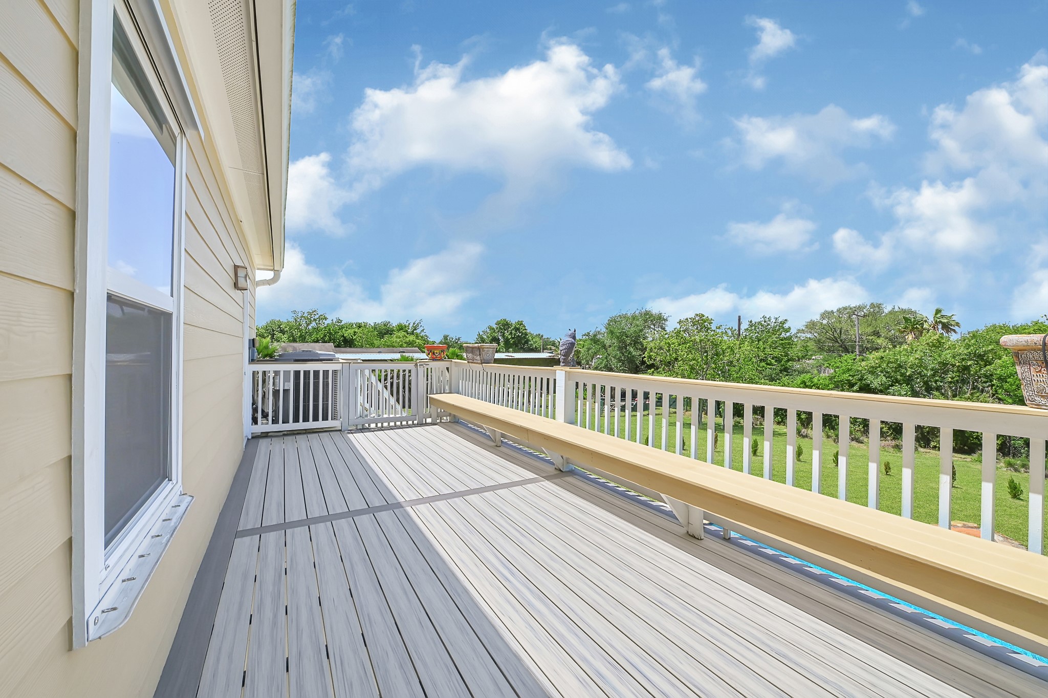1004 8th Street Dickinson, TX 77539 - Photo 39 of 42 a view of balcony with wooden floor and fence