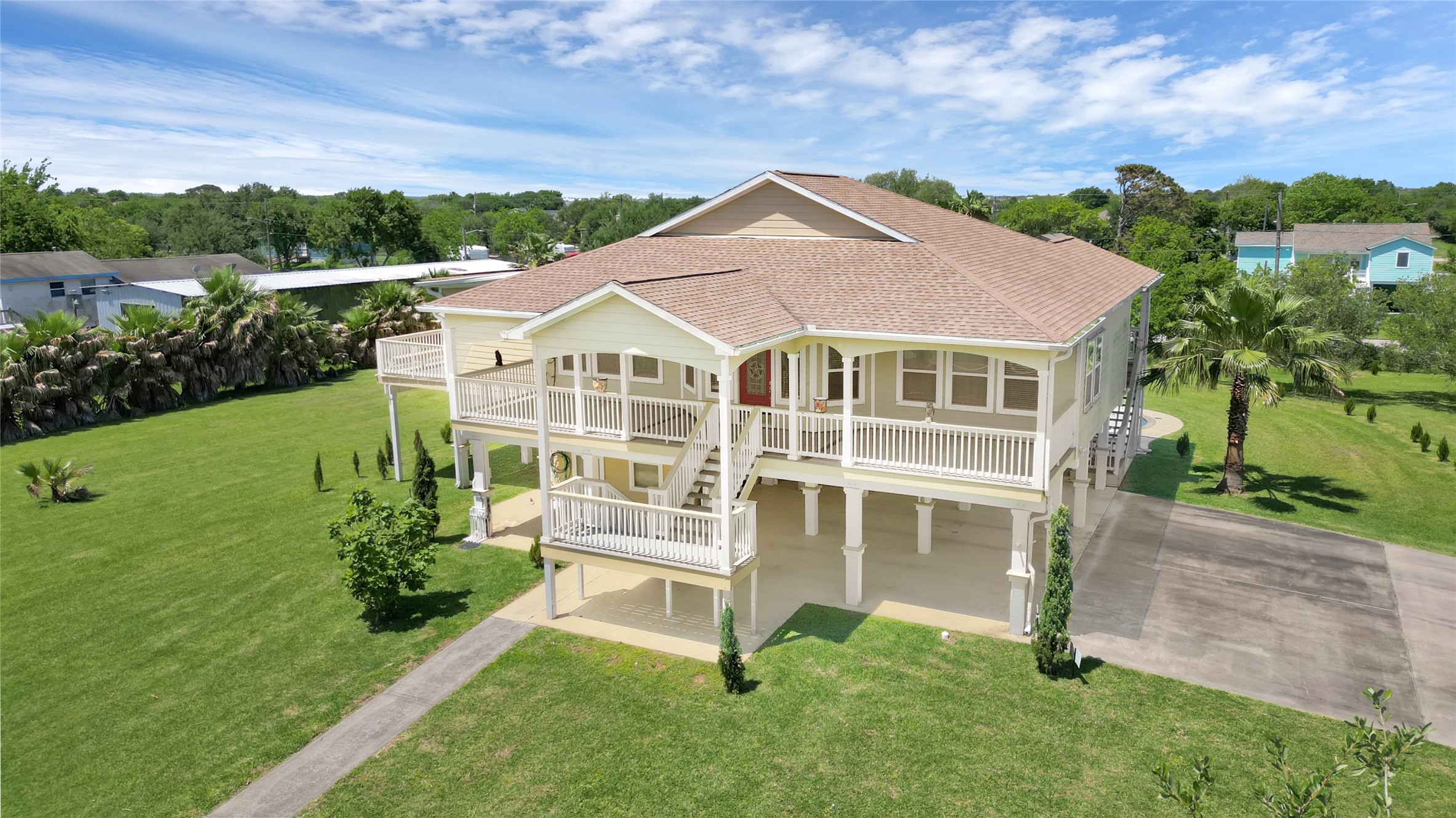 1004 8th Street Dickinson, TX 77539 - Photo 4 of 42 a front view of a house with a yard
