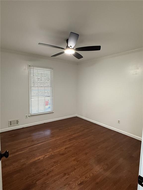 1438 Oak Forest Court Northeast Brookhaven, GA 30319 - Photo 12 of 15 wooden floor in an empty room with a window
