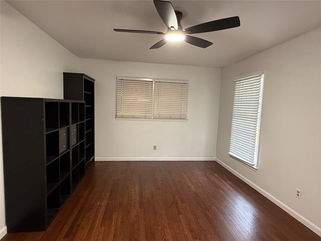 1438 Oak Forest Court Northeast Brookhaven, GA 30319 - Photo 13 of 15 wooden floor in an empty room with a window