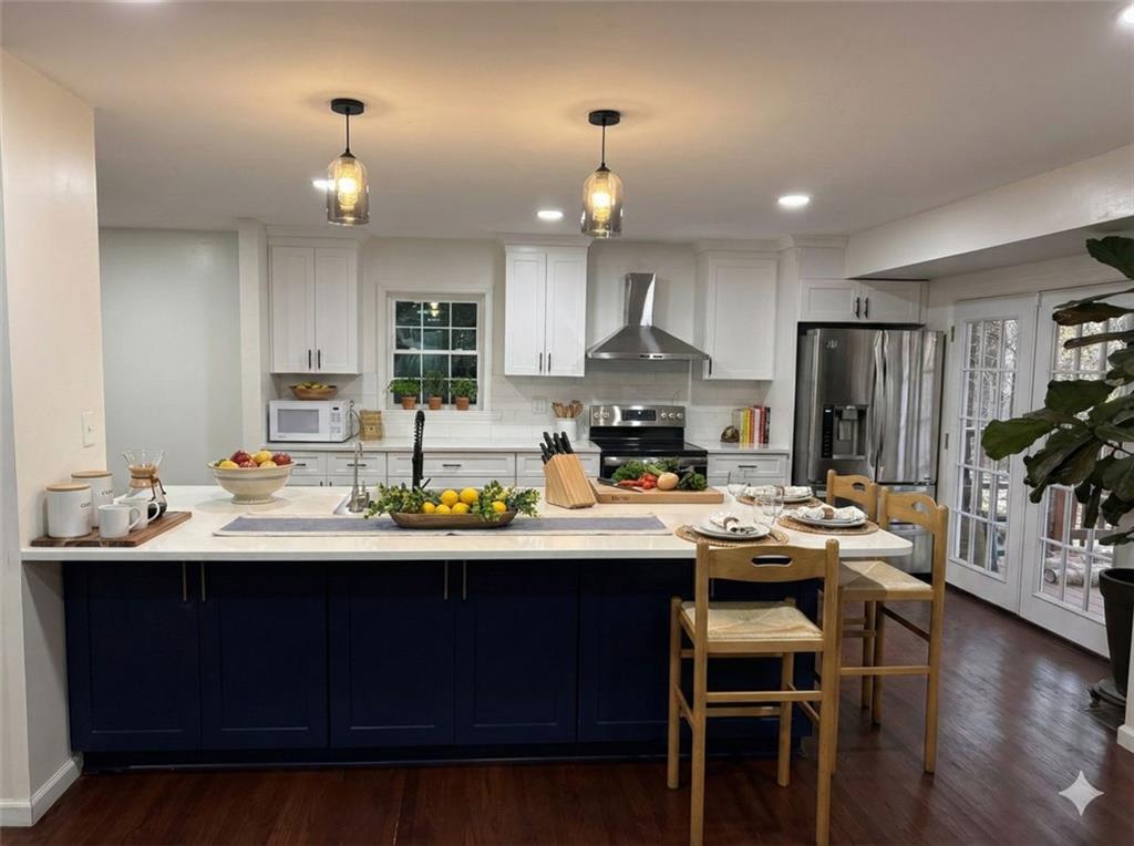 1438 Oak Forest Court Northeast Brookhaven, GA 30319 - Photo 4 of 15 a kitchen with a sink stainless steel appliances and cabinets