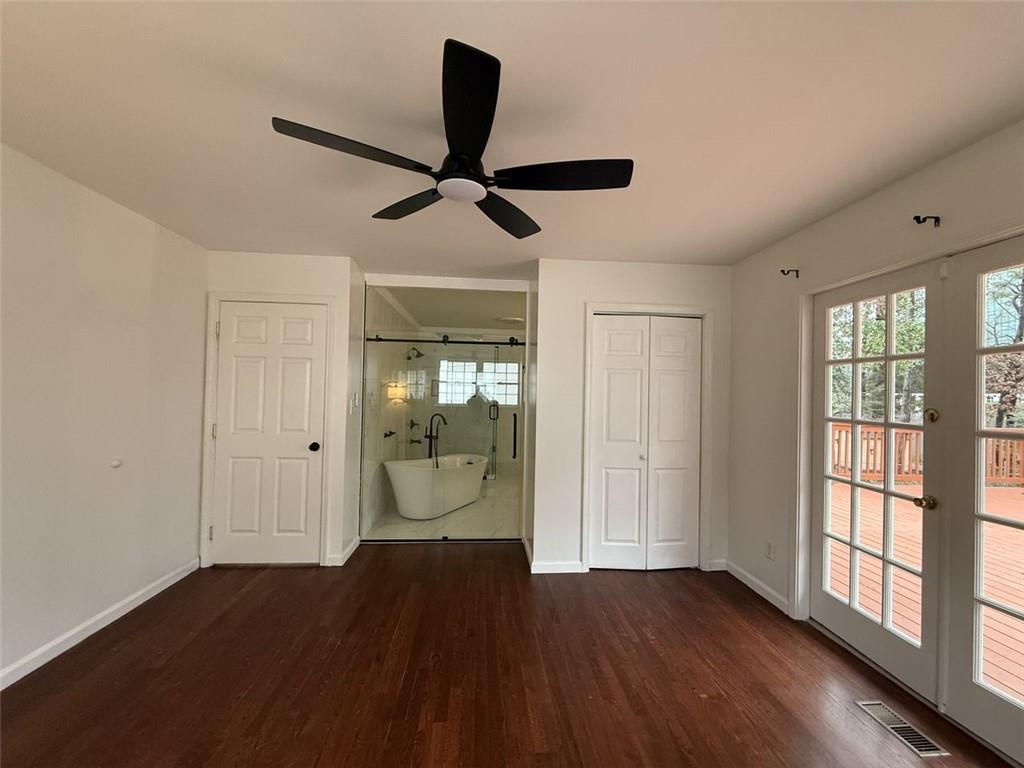 1438 Oak Forest Court Northeast Brookhaven, GA 30319 - Photo 10 of 15 a view of a room with wooden floor cabinet and windows
