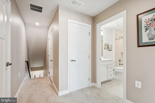 a view of a bathroom with a sink and a mirror