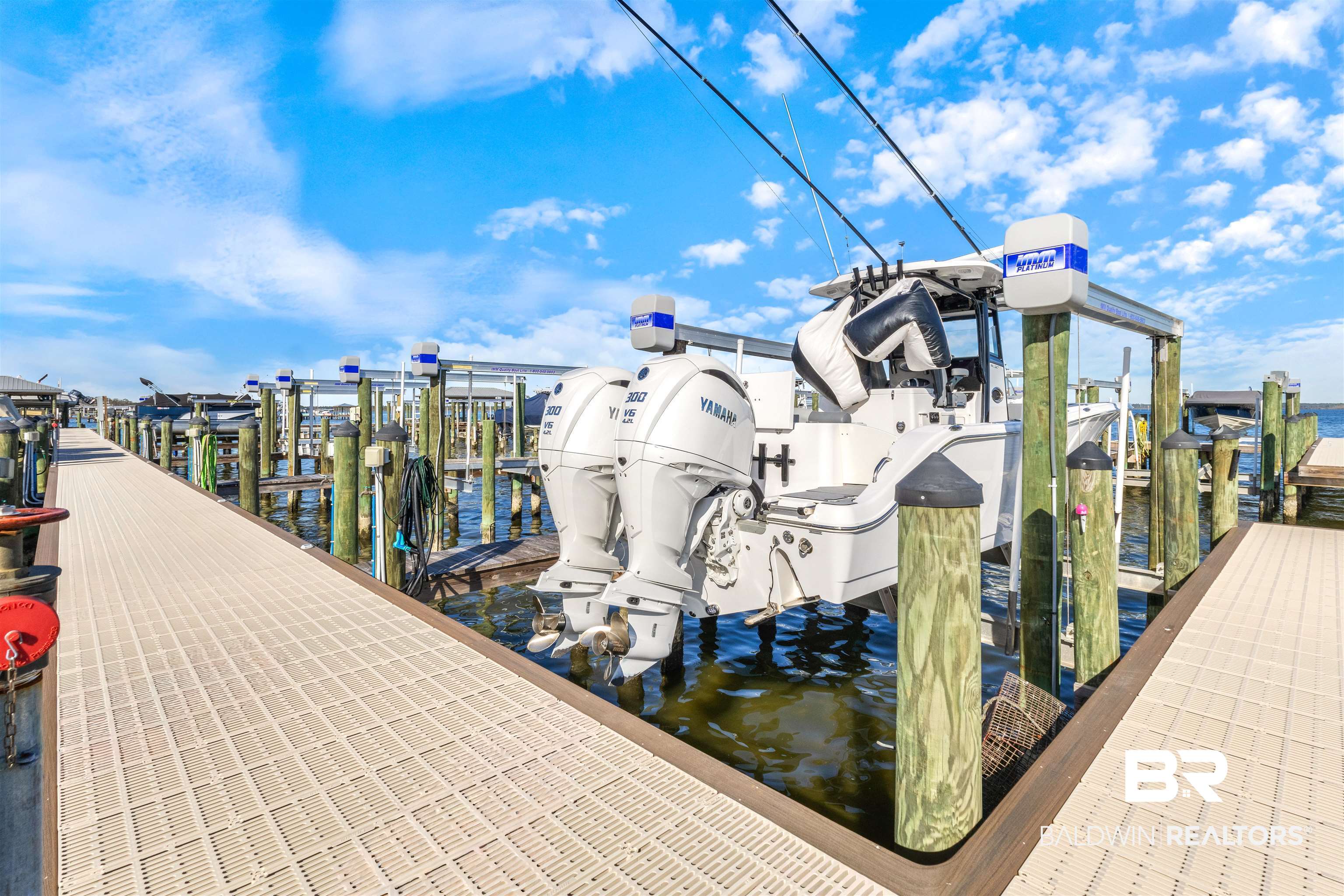 25861 Canal Road, Unit 3 Orange Beach, AL 36561 - Photo 32 of 40 Dock featuring boat lift and a water view