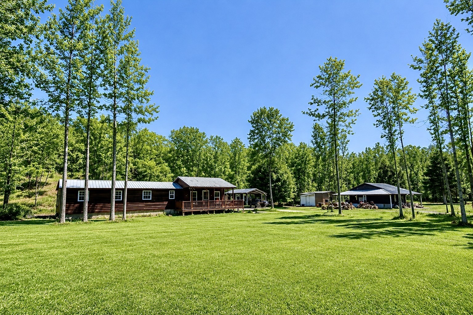 664 Russ Valley Road Lobelville, TN 37097 - Photo 1 of 63 a front view of a house with a garden