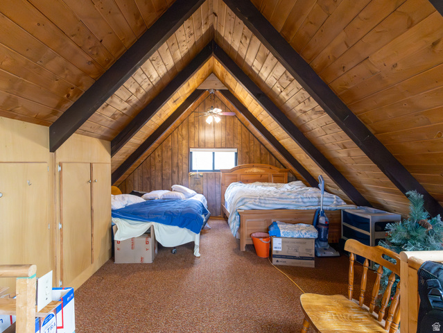 5082 Pine Crest Road Evanston, UT 82930 - Photo 15 of 25 Vaulted wood-paneled ceilings with exposed dark wood beams