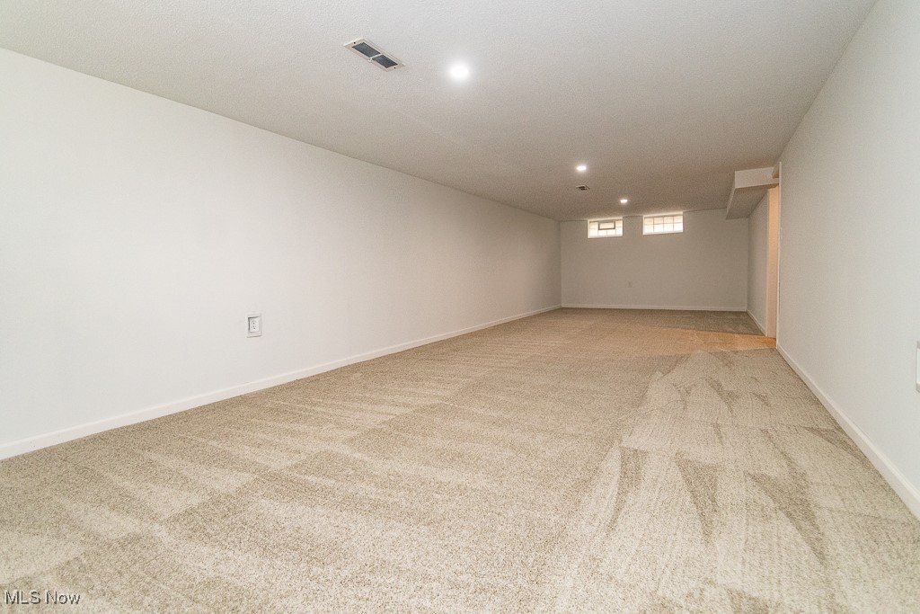 32609 Knobel Road Willowick, OH 44095 - Photo 22 of 29 Huge family room with new carpeting and lighting