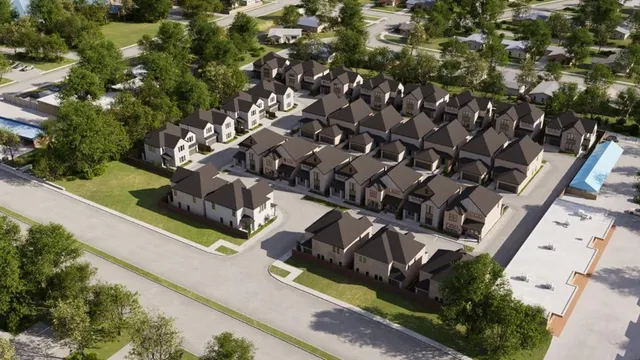 an aerial view of multiple houses with yard