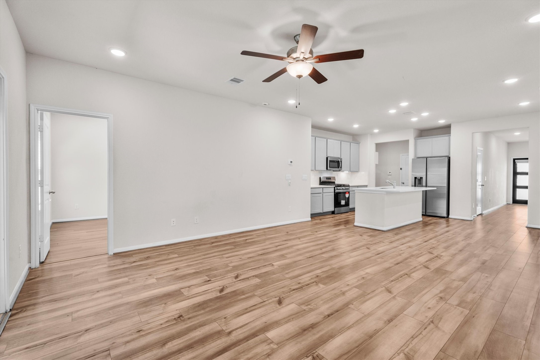 39 Courageous Side Way Magnolia, TX 77354 - Photo 11 of 44 Spacious family room with seamless flow to the kitchen and dining area