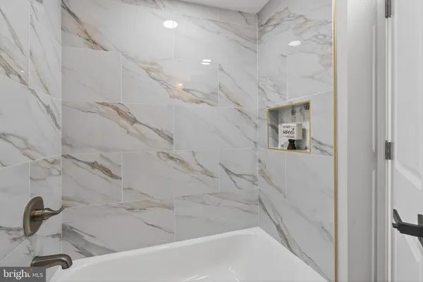 a bathroom with a bathtub and a sink