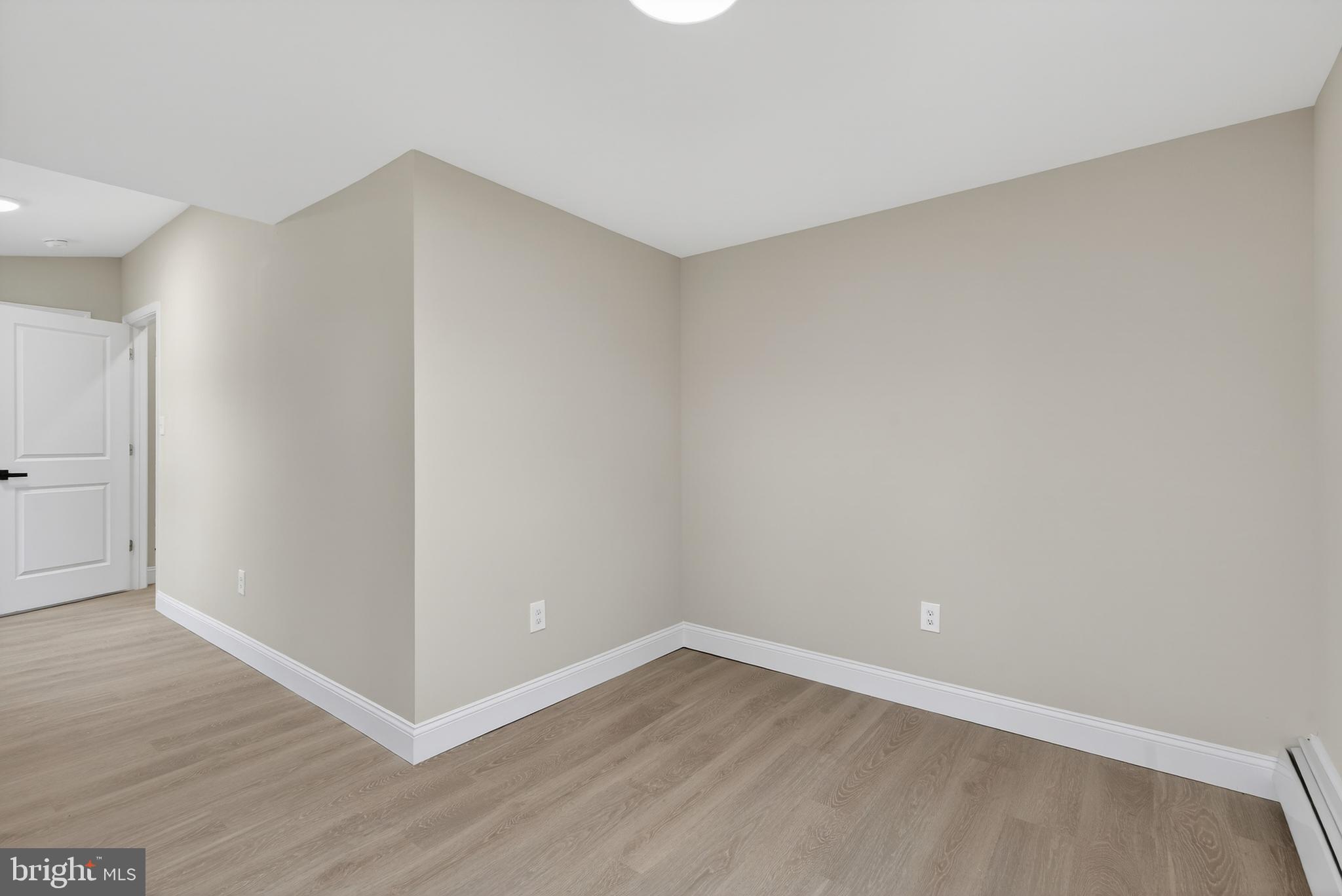 226 Ruth Avenue Maple Shade, NJ 08052 - Photo 21 of 32 a view of an empty room with wooden floor