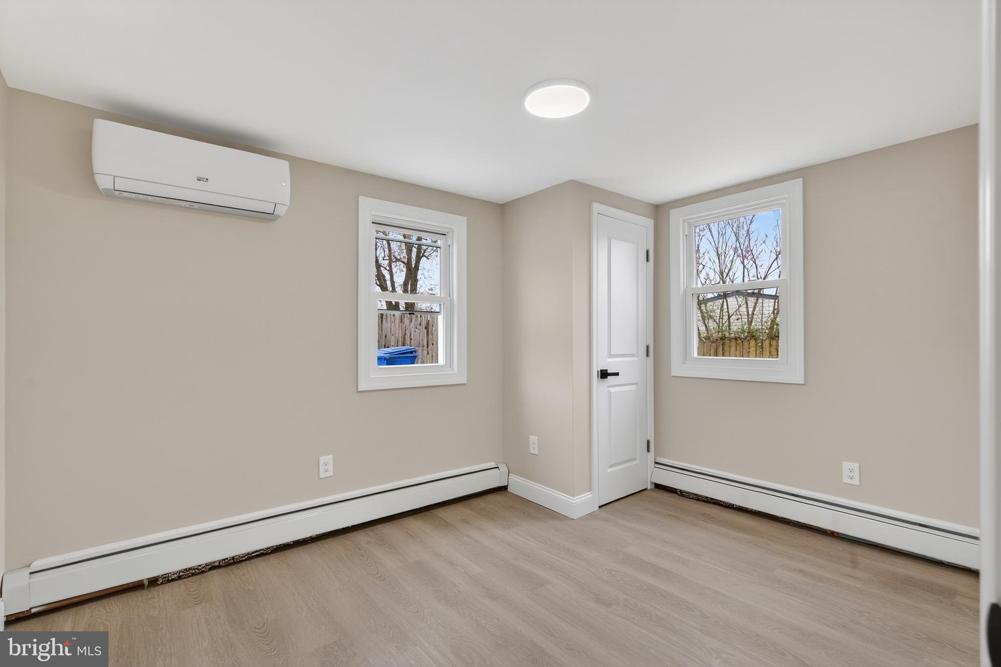 226 Ruth Avenue Maple Shade, NJ 08052 - Photo 22 of 32 a view of an empty room with wooden floor and a window