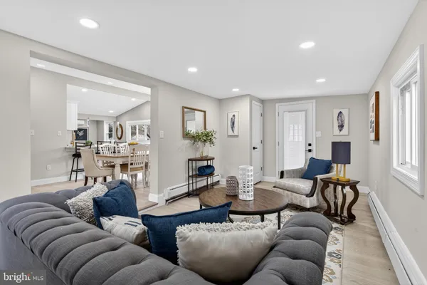 a living room with furniture and a table