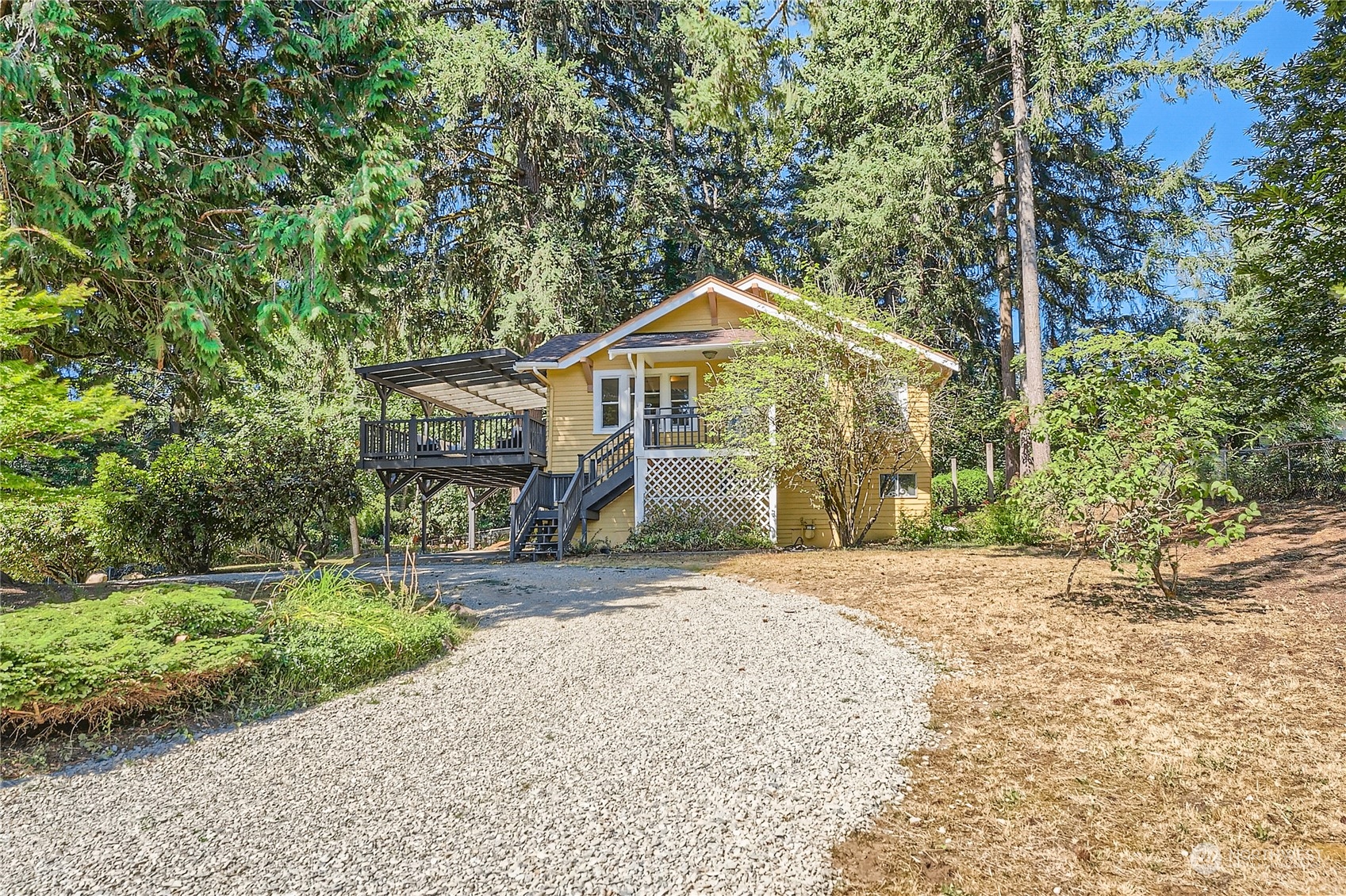 18045 120th Avenue Southeast Renton, WA 98058 - Photo 1 of 23 a front view of a house with a garden