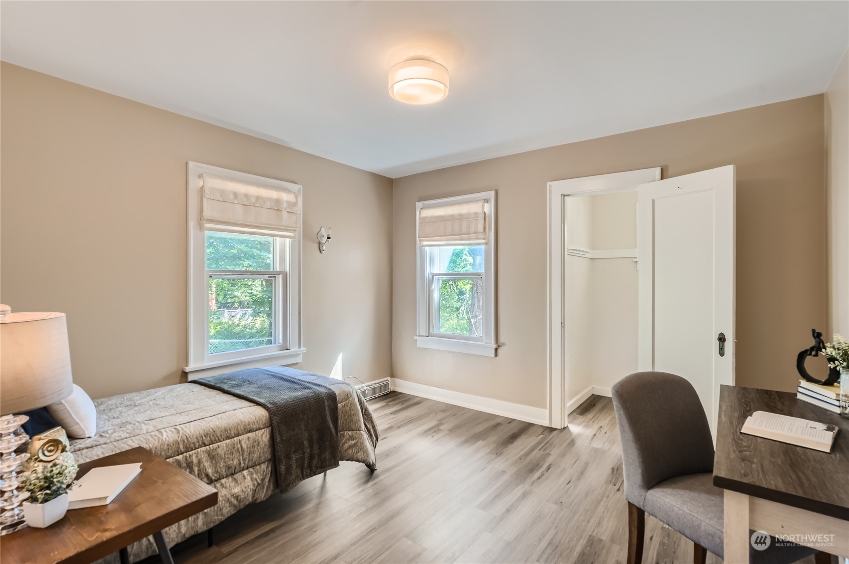 18045 120th Avenue Southeast Renton, WA 98058 - Photo 12 of 23 a bedroom with a bed and a chair