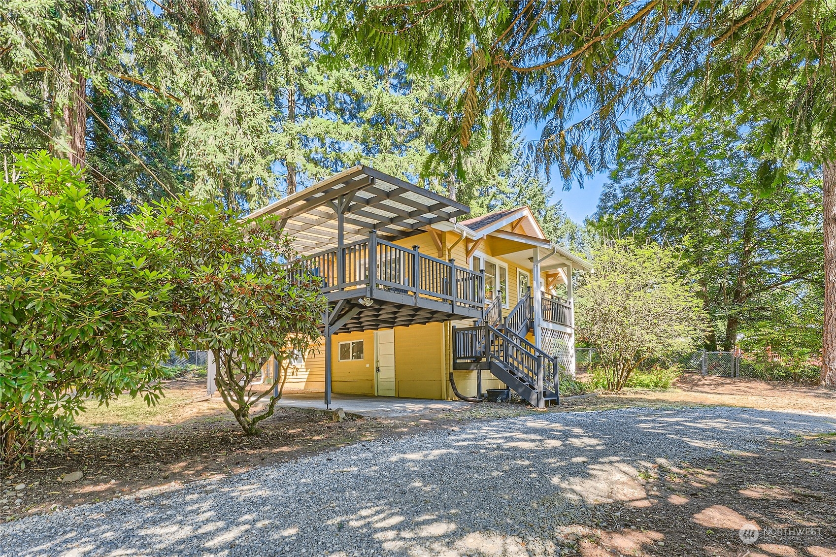 18045 120th Avenue Southeast Renton, WA 98058 - Photo 16 of 23 a front view of a house with a yard and garage