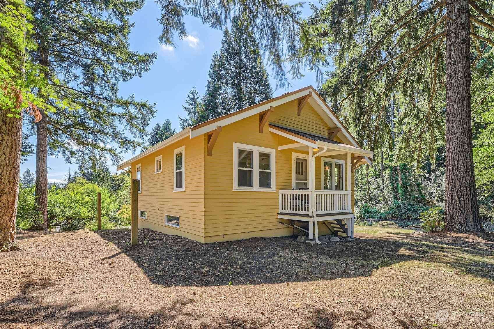 18045 120th Avenue Southeast Renton, WA 98058 - Photo 21 of 23 a front view of a house with a yard and trees