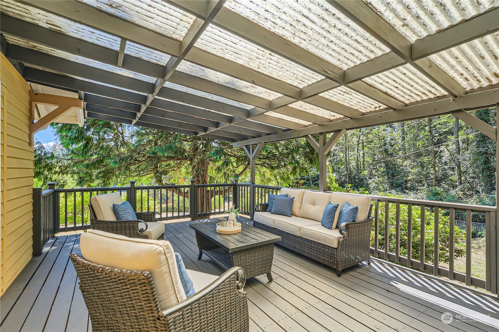 18045 120th Avenue Southeast Renton, WA 98058 - Photo 4 of 23 a balcony with furniture and a potted plant