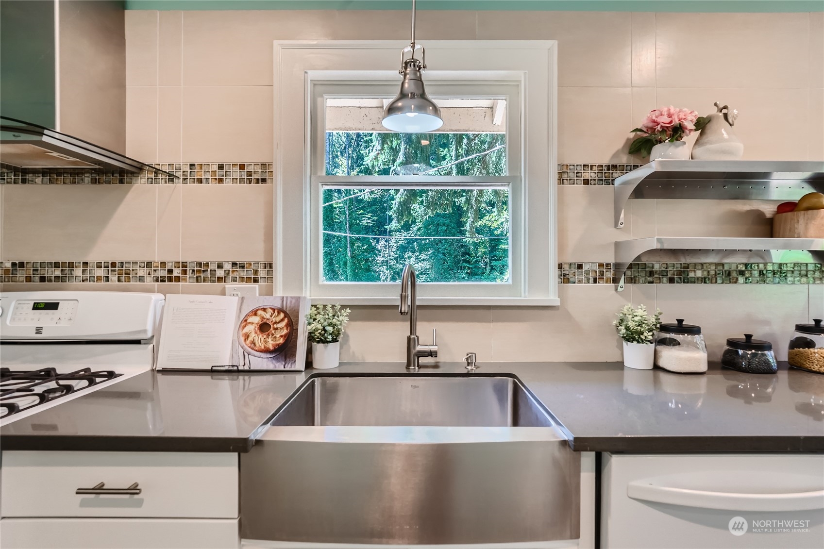 18045 120th Avenue Southeast Renton, WA 98058 - Photo 8 of 23 a kitchen with a sink and a stove