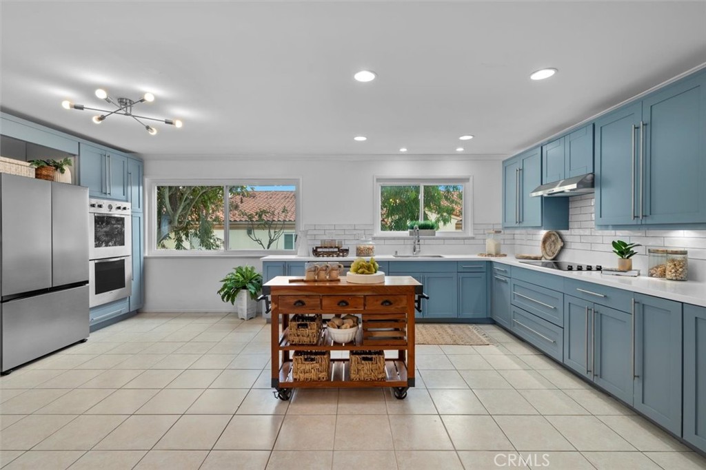 1200 Opal Street, Unit 7 Redondo Beach, CA 90277 - Photo 12 of 40 a kitchen with granite countertop a counter top space appliances and a window