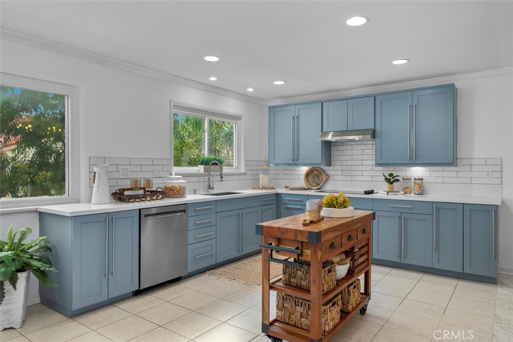 1200 Opal Street, Unit 7 Redondo Beach, CA 90277 - Photo 14 of 40 a kitchen with a sink stove and cabinets