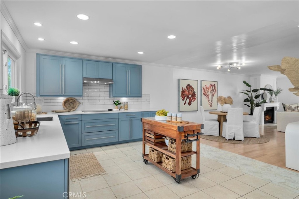 1200 Opal Street, Unit 7 Redondo Beach, CA 90277 - Photo 15 of 40 a kitchen with stainless steel appliances kitchen island granite countertop a sink and cabinets