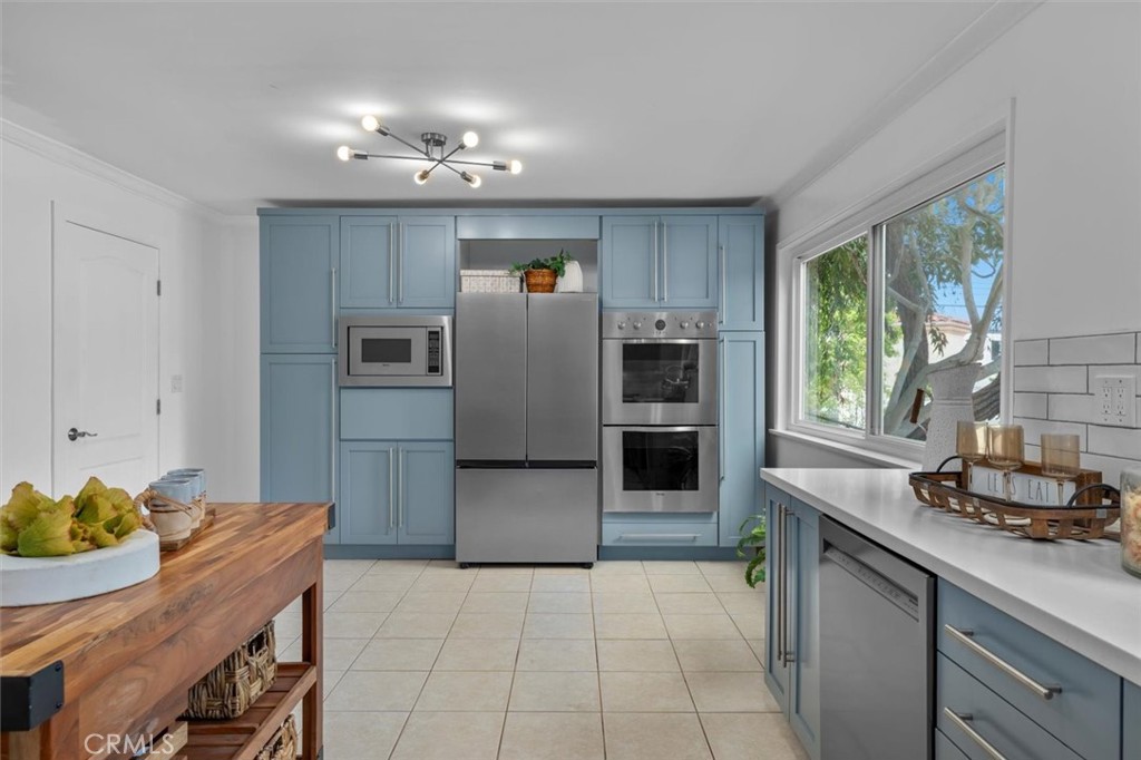 1200 Opal Street, Unit 7 Redondo Beach, CA 90277 - Photo 16 of 40 a kitchen with refrigerator and cabinets